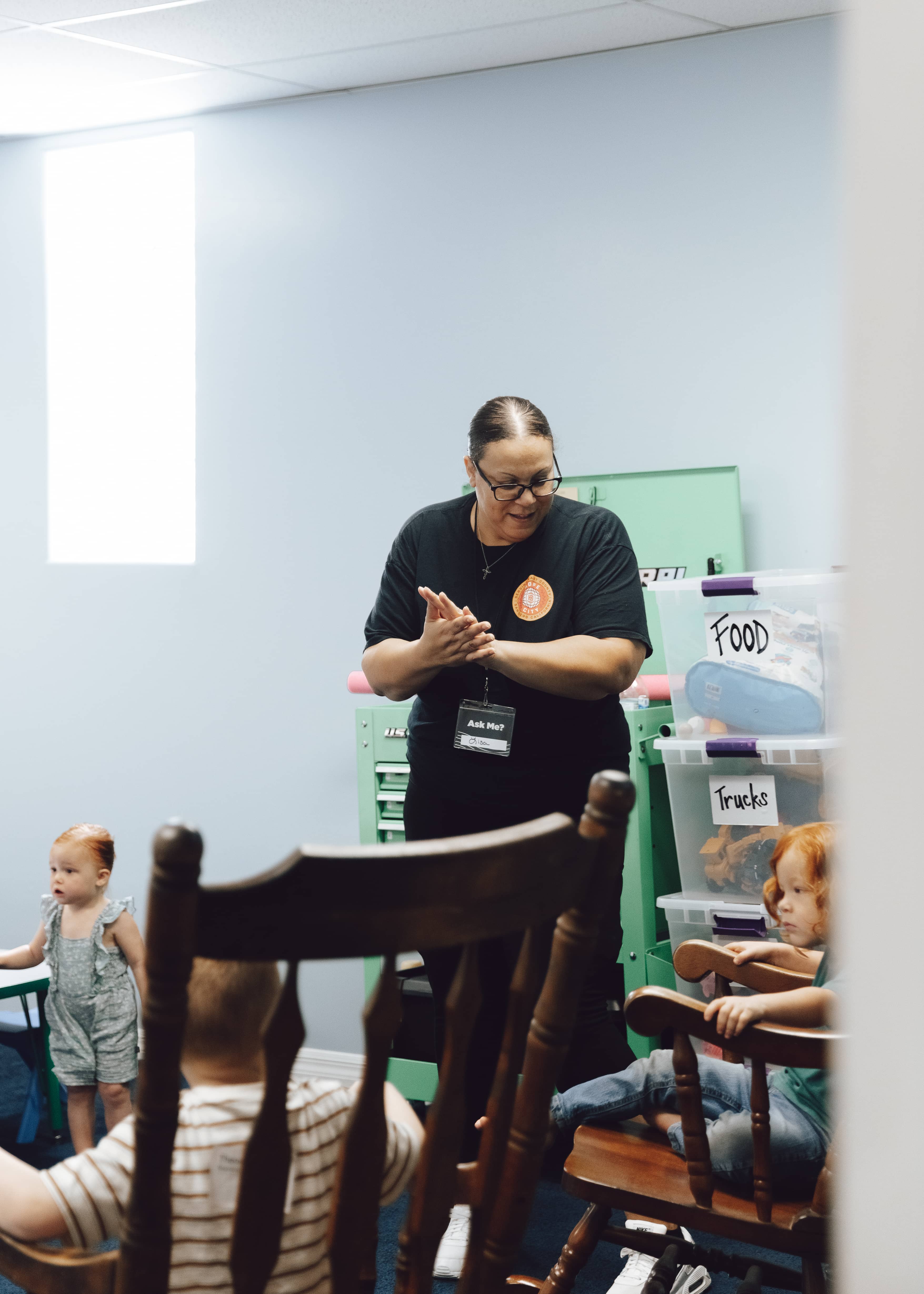 Volunteer leading kids at Hope City